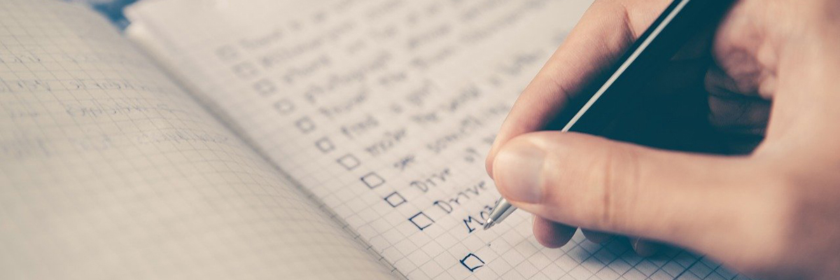 Hand writing a checklist