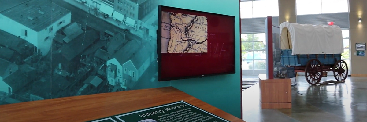 Video screen inside a museum exhibit space.