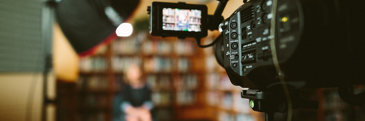 Video camera, light kit and subject being interviewed.